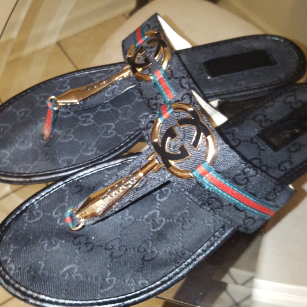 Black Gucci sandals
